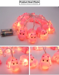 Detail view of pink hippo LED string lights with warm glow and clear battery box