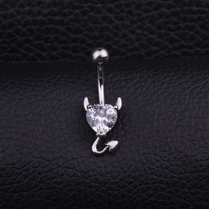 Polished heart-shaped belly button ring with devil horns and sparkling gemstone pendant