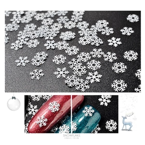 White snowflake nail art sequins in various sizes for Christmas winter manicure decor