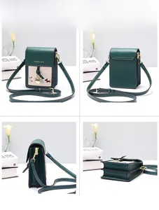 Detail view of mini green crossbody bag featuring three compartments and animal embroidery
