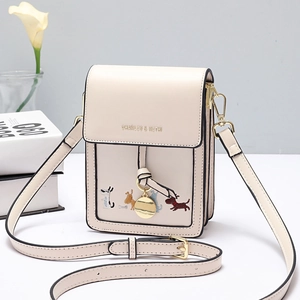 Cream mini crossbody bag with colorful dog embroidery and adjustable strap in studio view