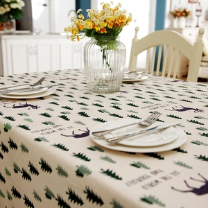Beige cotton linen Christmas tablecloth with green pine trees and purple reindeer patterns