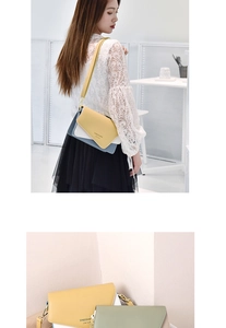 Detail of color-block leather crossbody bag with metal magnetic buckle and adjustable strap