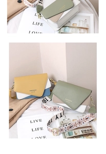Detail view of contrast color crossbody bag with ethnic snowflake pattern wide strap