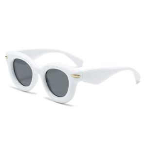 Fashionable thick white frame oversized sunglasses with dark lenses and gold accents