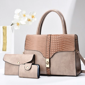 Three-piece women's taupe handbag set with crocodile pattern and golden hardware