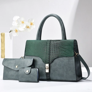Three-piece women's handbag set in deep teal with green crocodile texture and gold hardware