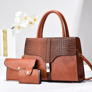 Luxury 3-piece set with crocodile-embossed caramel leather tote, clutch, and card holder