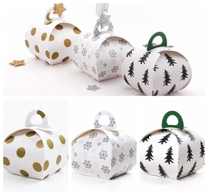 Creative Christmas gift boxes with gold dots, silver snowflakes, and green tree patterns