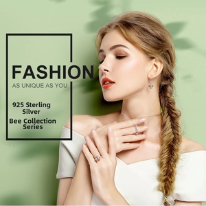 Model wearing 925 sterling silver bee jewelry set with necklace, earrings and ring
