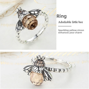 Detailed close-up of S925 sterling silver bee ring with faceted brown zircon stones