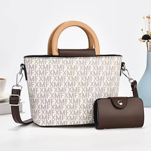 Elegant white printed tote bag with round wood handles and matching small pouch bag