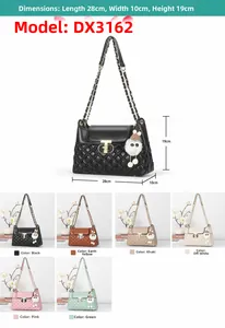 Detailed view of quilted faux leather shoulder bag with chain strap and fuzzy ball charm