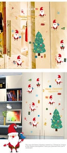 Detail showing Santa Claus and snowflake stickers on glass door and cabinet surfaces
