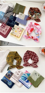 Detailed view of folded cotton square scarves with vintage bohemian floral prints