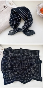 Detailed view of square cotton scarf with classic black and white polka dot floral patterns