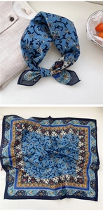 Detail view of square cotton scarf showing vintage floral patterns and woven texture