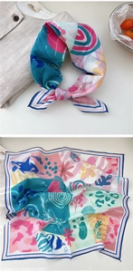 Detailed view of marine print silk scarf featuring orcas, tropical fish and sea shells
