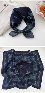 Detail view of the intricate paisley and mandala pattern on the navy blue cotton square scarf