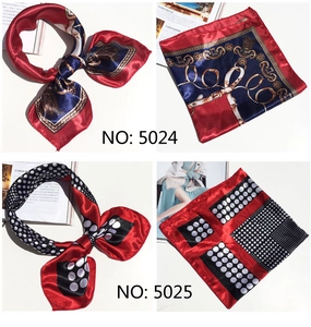 Detail of satin square scarves with classic horse chain and modern polka dot prints