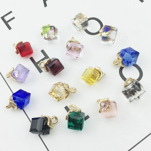 Macro detail of cube crystal pendants in various colors with gold metal clasps