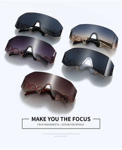 Detailed view of five frameless oversized sunglasses with decorative metal side chains