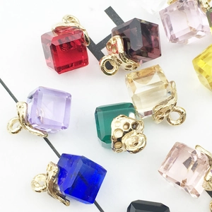 Macro view of colorful cube crystal pendants for DIY jewelry and earring crafts