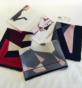 Detail of geometric thick pashmina scarves in various colors with stylish home decor