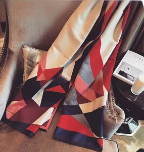 Detail shot of geometric color-block scarf with thick fabric and fringe tassels