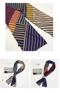 Macro detail of multicolored geometric striped satin scarf with smooth silk texture