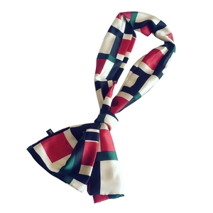 Elegant geometric color-block silk scarf with satin finish and red, green, and navy panels