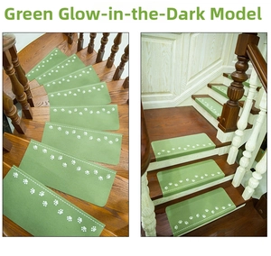 Luminous green stair tread mat with white paw prints on wooden stairs for safety