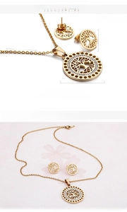 Macro shot of 18K gold plated tree of life jewelry set with sparkling crystals
