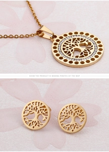 Macro detail of 18k gold plated tree of life jewelry set with sparkling crystals