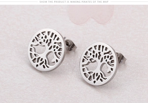 Detailed close-up of silver circular stud earrings featuring hollow Tree of Life design