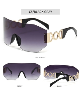 Detail view of C5 rimless cycling sunglasses with gold decorative hardware and gradient lenses