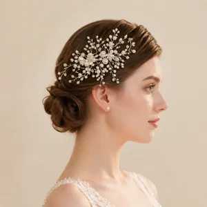 Detail of silver bridal hair comb with pearls and rhinestones on a female model
