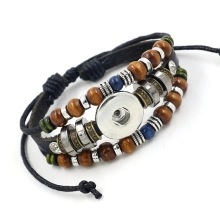 Macro shot of a multilayered braided leather bracelet with metal spring clasp and wood beads