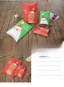 Detail view of Santa and Reindeer pillow boxes with size specs and 350g cardboard texture