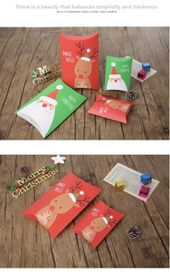 Detailed view of Christmas pillow gift boxes with reindeer and Santa Claus illustrations