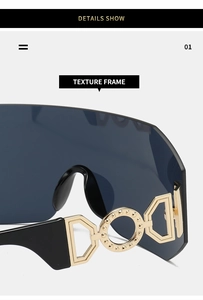 Detail shot of golden DGD metal logo hinge on black rimless oversized cycling sunglasses
