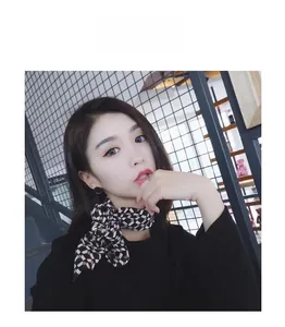 Classic black and white checkered silk-feel neckerchief styled on a model for a chic look