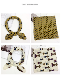 Detail view of cotton linen square scarves with chevron stripes and vintage medal patterns