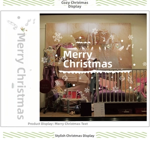 Detail of Christmas window stickers featuring Merry Christmas text and reindeer motifs