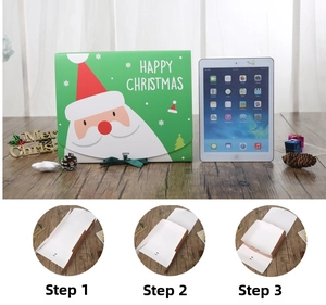 Detailed assembly steps for a green Christmas gift box with Santa Claus motif and ribbon