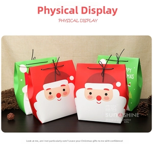 Detail of Christmas paper gift bags with Santa Claus graphics and gold foil accents