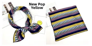 Dettaglio del foulard in seta New Pop Yellow con motivi geometrici blu e gialli