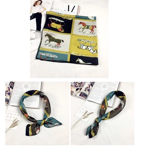 Dettaglio di un foulard di seta equestre vintage con motivi di cavalli verdi e gialli
