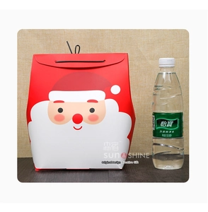 Detail of red Christmas gift bag with Santa Claus print and black handles with size reference
