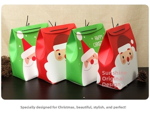 Detail of red and green Christmas gift bags with Santa cartoons and gold stamping